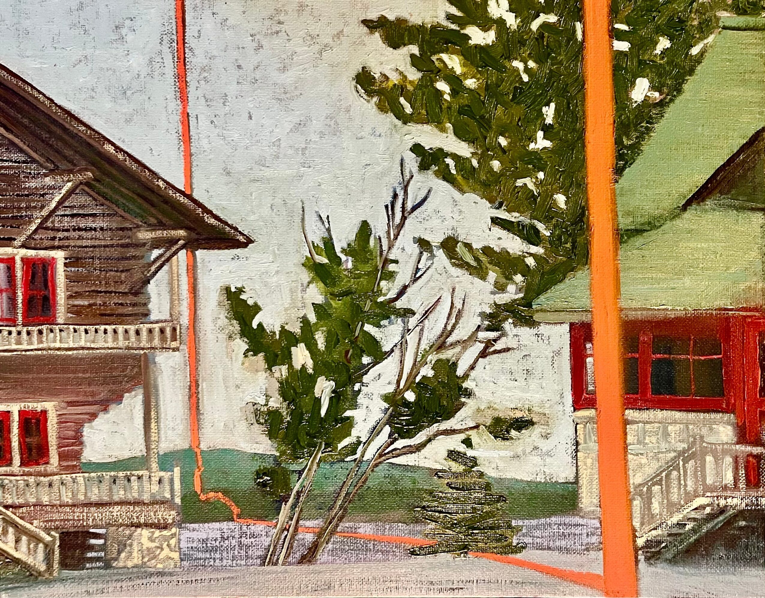 A tree with green leaves in front of buildings with red and green roofs, and a white wall in the background.