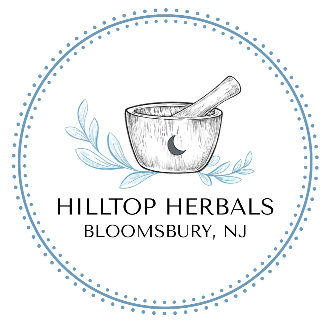 A mortar and pestle with a crescent moon, surrounded by leaves, and text about Hilltop Herbals in Bloomsbury, NJ.