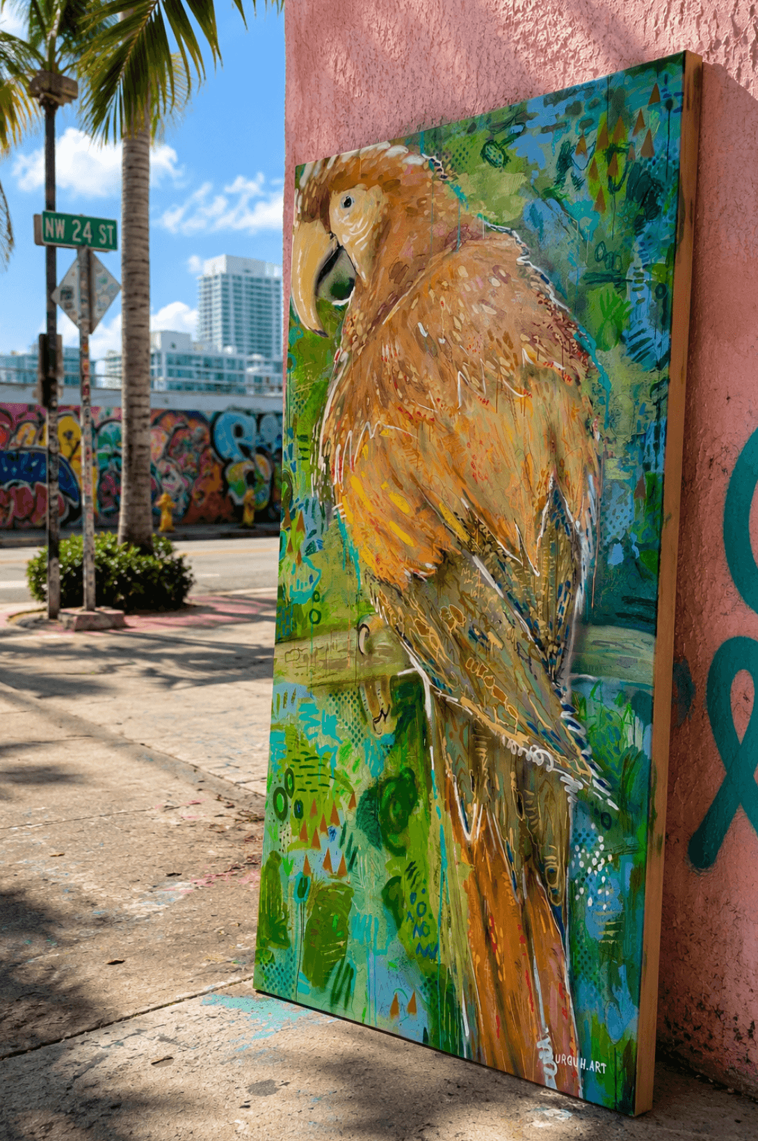 Painting of a bird with brown and orange feathers on a colorful background, leaning against a pink wall.
