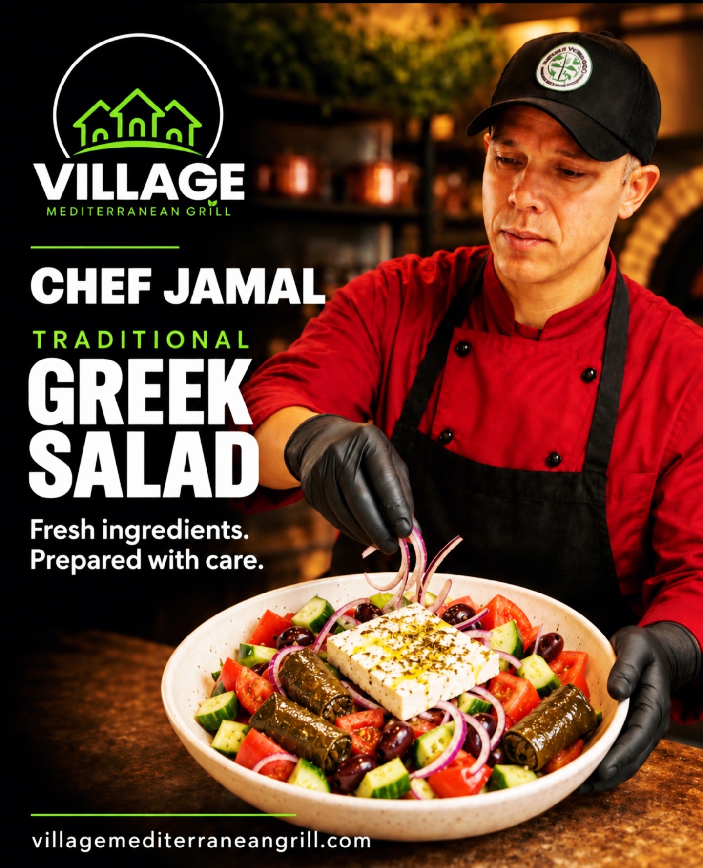 Chef in red uniform and black cap holding a Greek salad with vegetables and feta cheese in a restaurant setting.