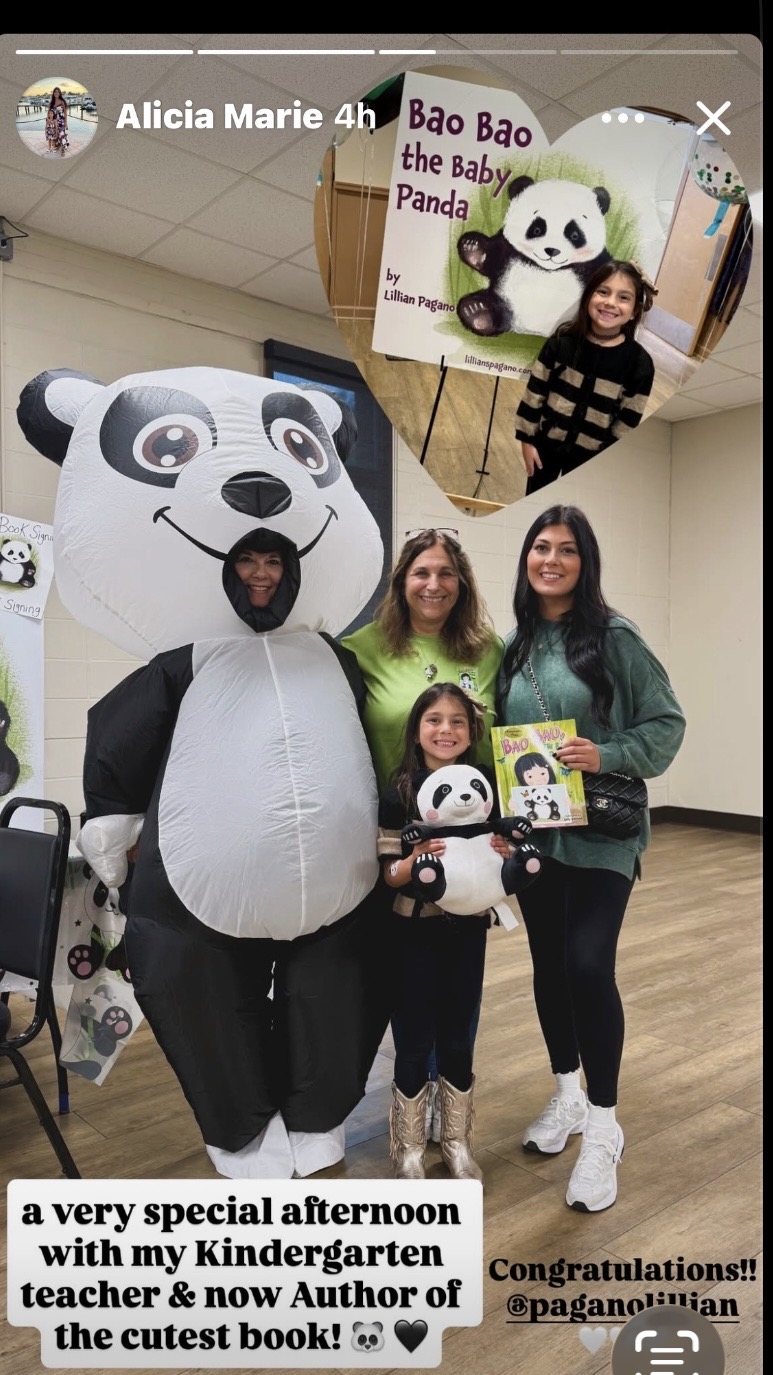 Four people, one in a panda costume, holding a book, in a room with a panda-themed poster. One person is in a panda mask.